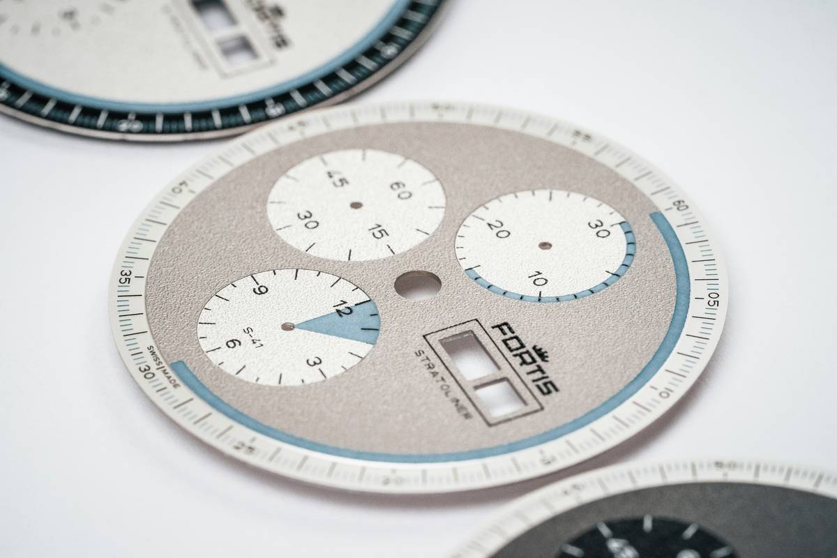 Bar chart showing 2023 secondary market appreciation: exclusive colorways vs. standard models across Rolex, Omega, Seiko