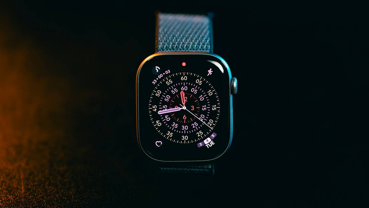 Luxury watch with vibrant custom dial colors on artisan workbench
